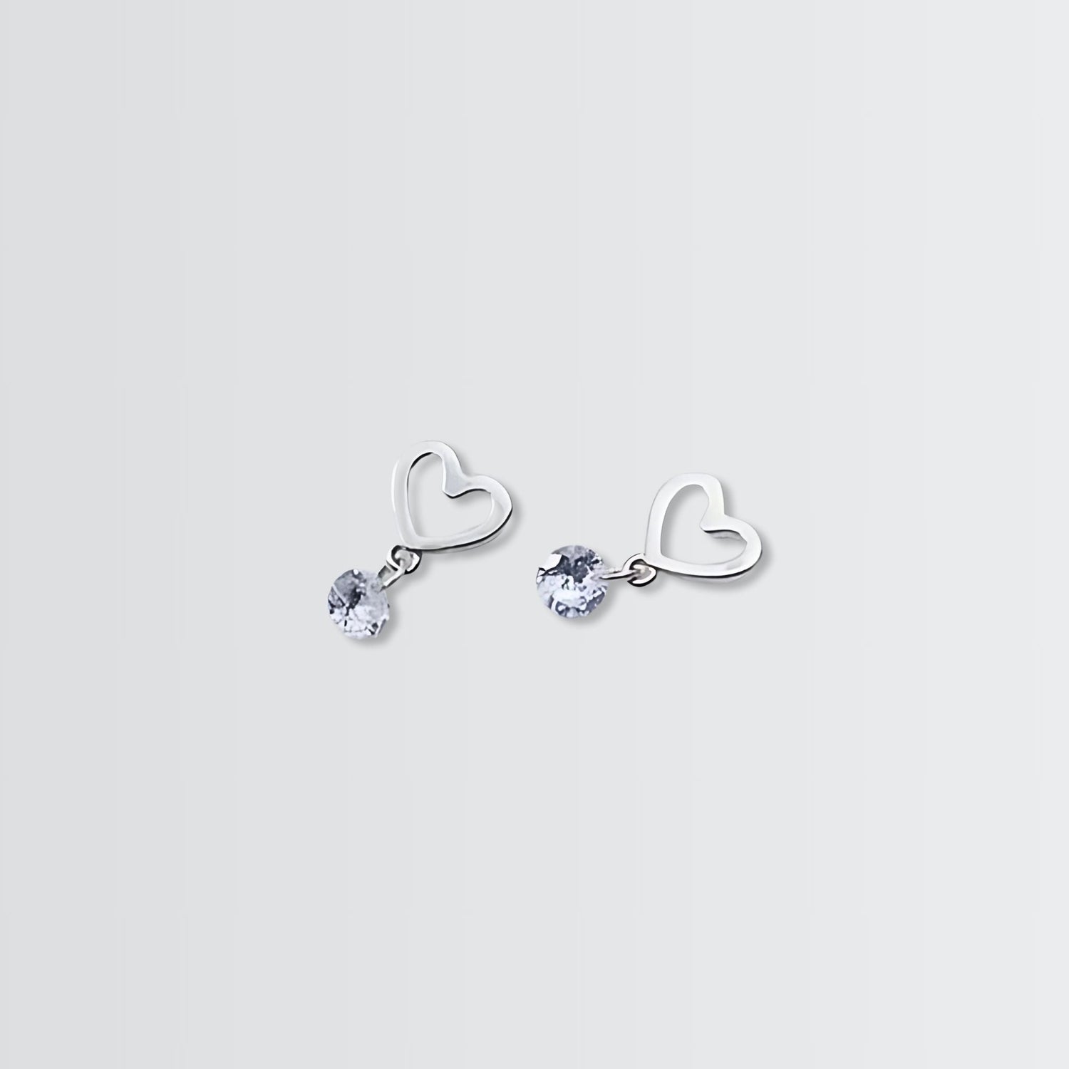 Swaying Solitaire On Heart Minimal Studs